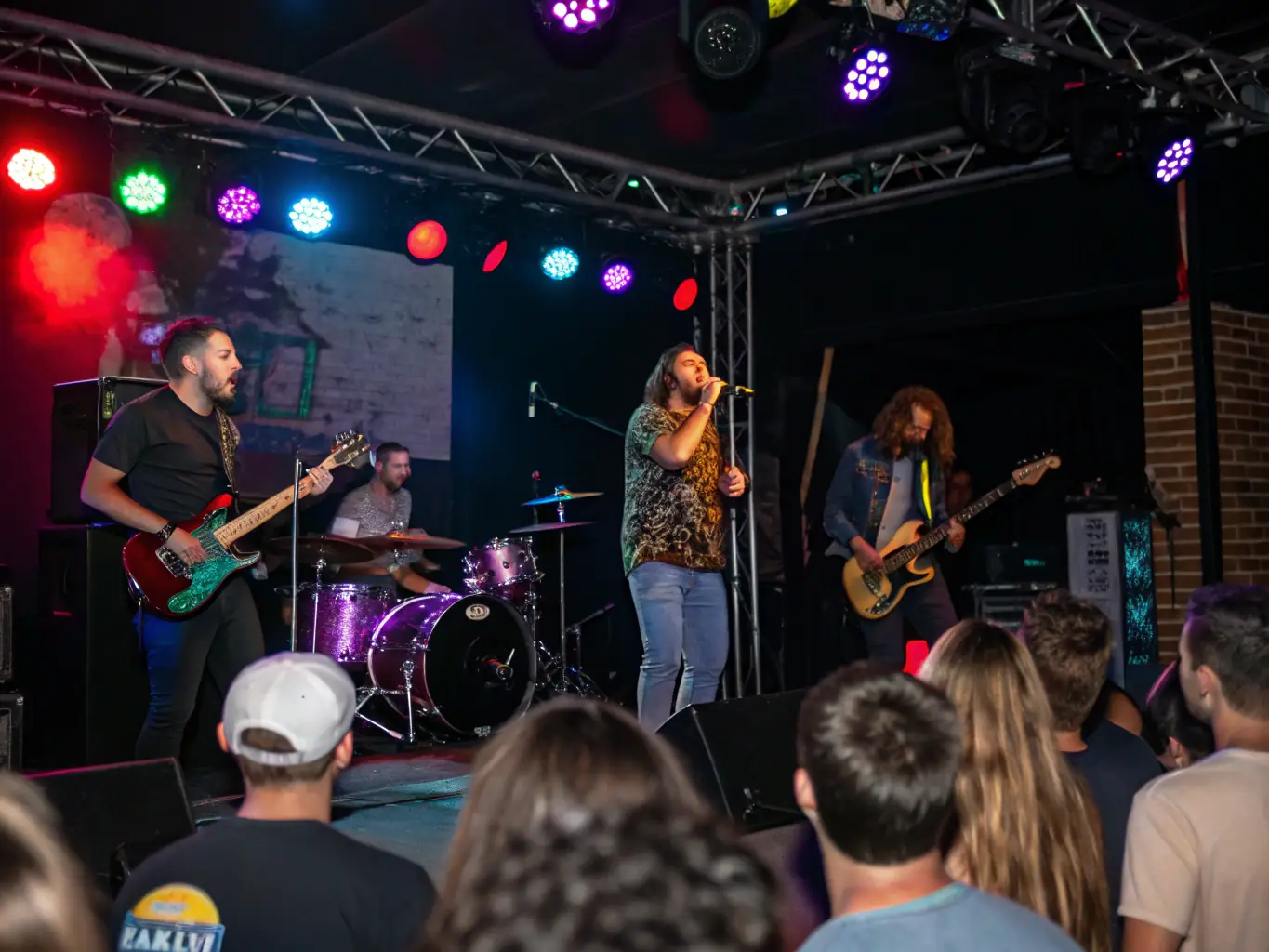 A vibrant image showcasing a live performance during the 'New Sounds Series', with musicians passionately engaged and an attentive audience enjoying the contemporary music.